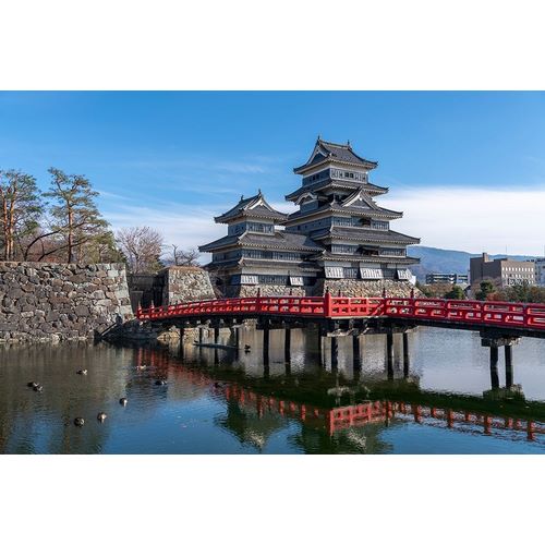 The Matsumoto Castle as seen from the bridge with the city buildings in the background-Japan